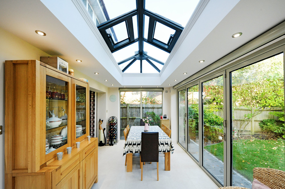 This is an example of a contemporary dining room in Hampshire.