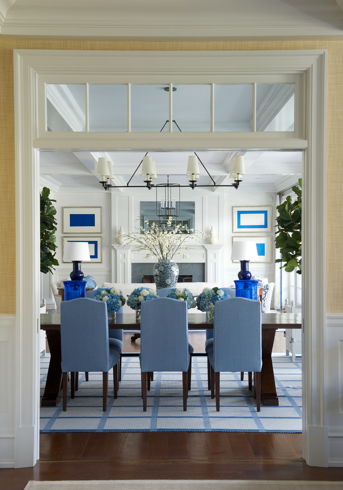 Inspiration for a coastal dark wood floor enclosed dining room remodel in New York with white walls