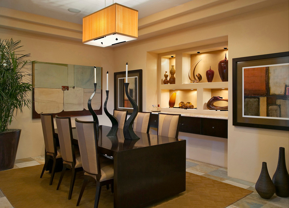 Contemporary dining room in Orange County with beige walls.