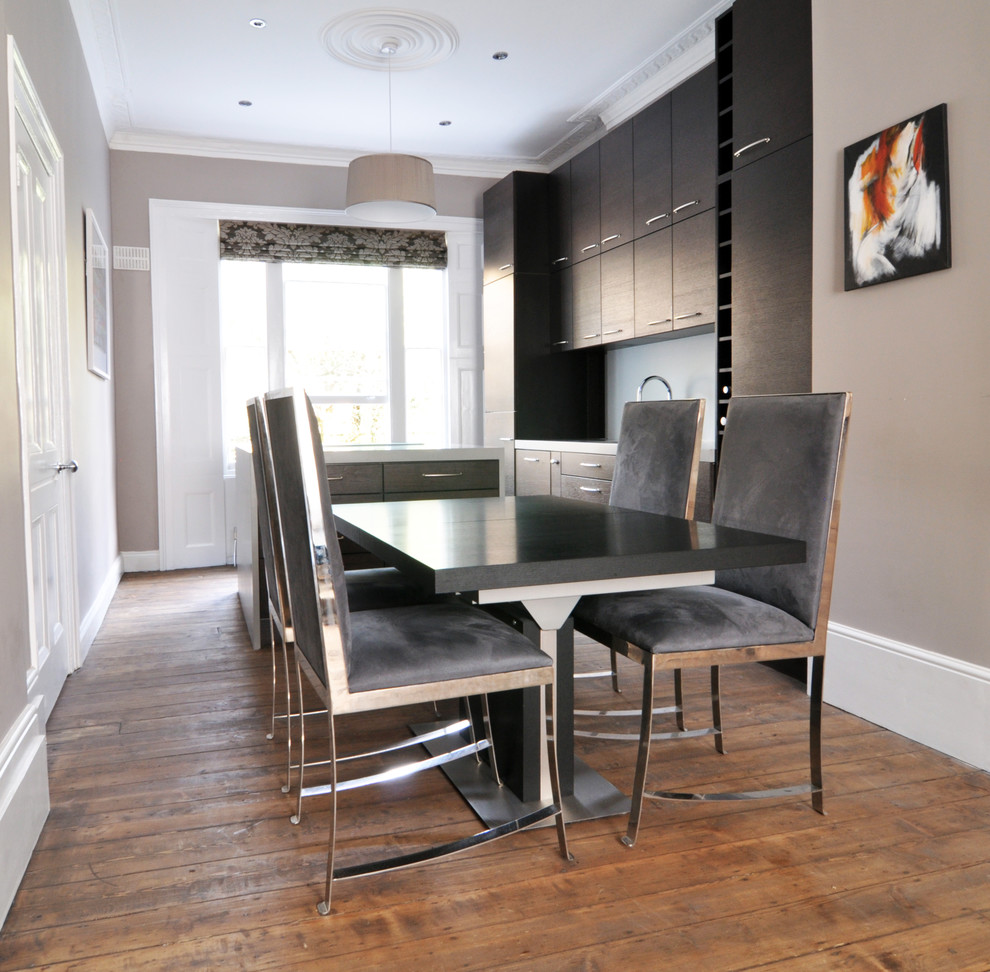 Photo of a medium sized contemporary open plan dining room in London with medium hardwood flooring.