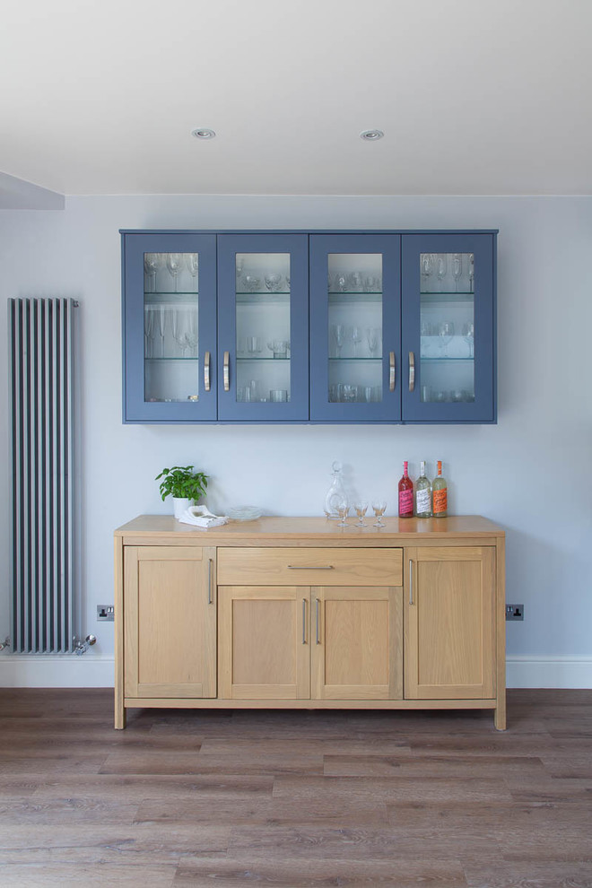 Medium sized contemporary kitchen/dining room in Surrey with medium hardwood flooring.
