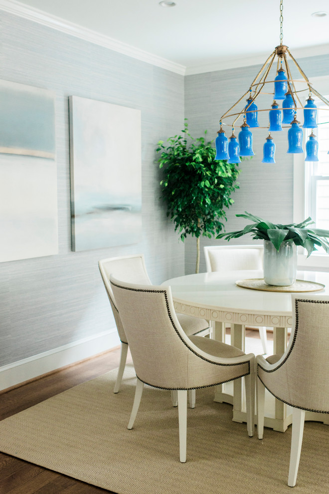 Inspiration for a medium sized modern enclosed dining room in Baltimore with blue walls and medium hardwood flooring.