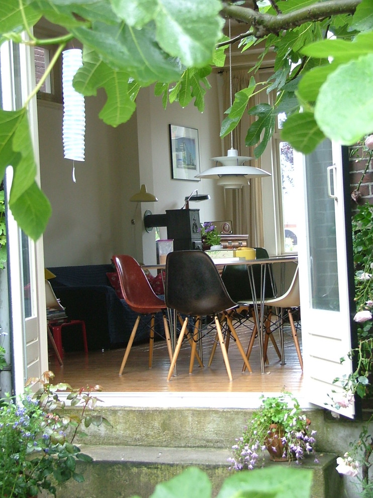 Retro dining room in Amsterdam with white walls.