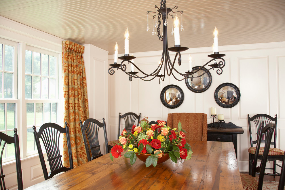 Photo of a rural dining room in Boston with white walls.