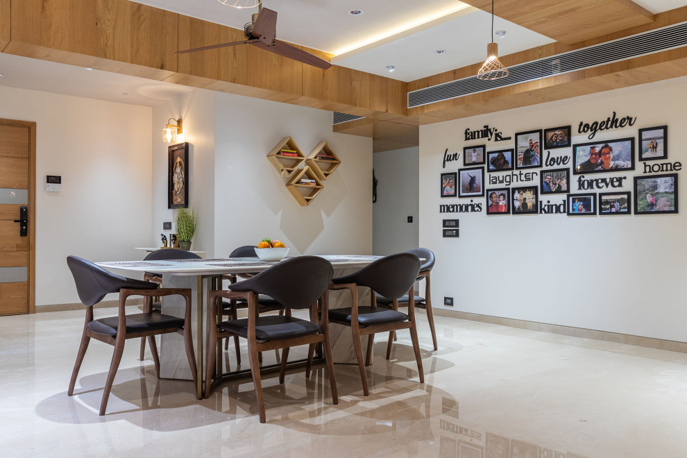 This is an example of a modern dining room in Ahmedabad.