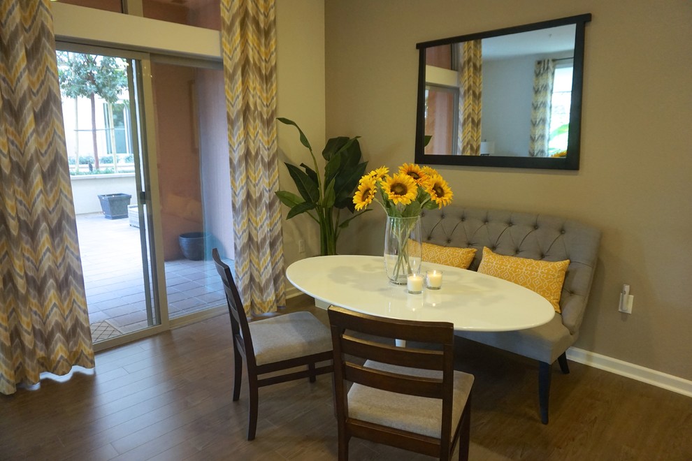 Example of a small trendy linoleum floor dining room design in Sacramento with gray walls