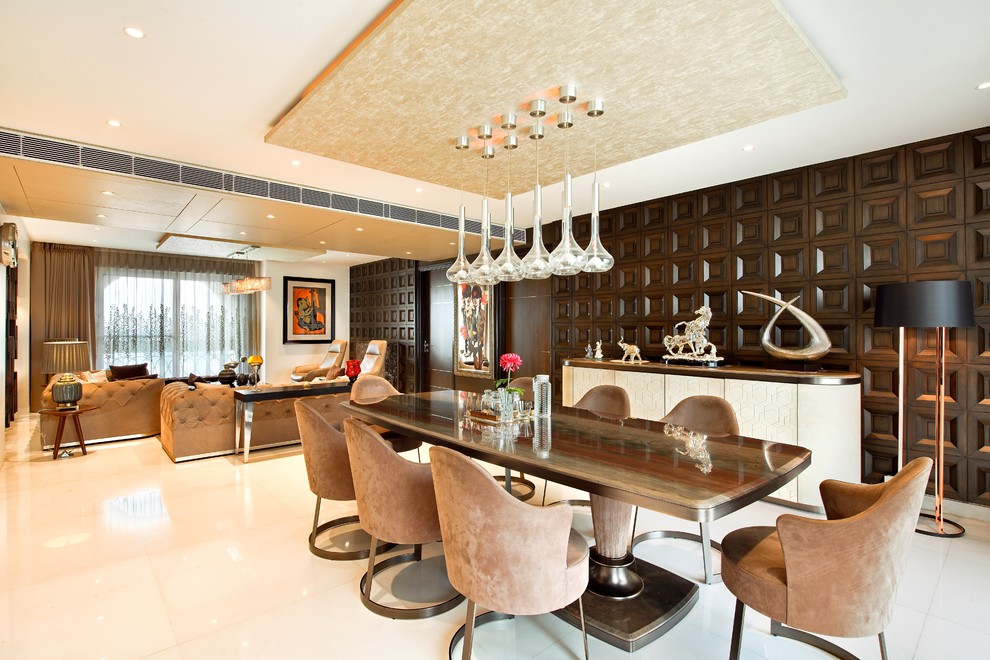 Example of a trendy dining room design in Delhi