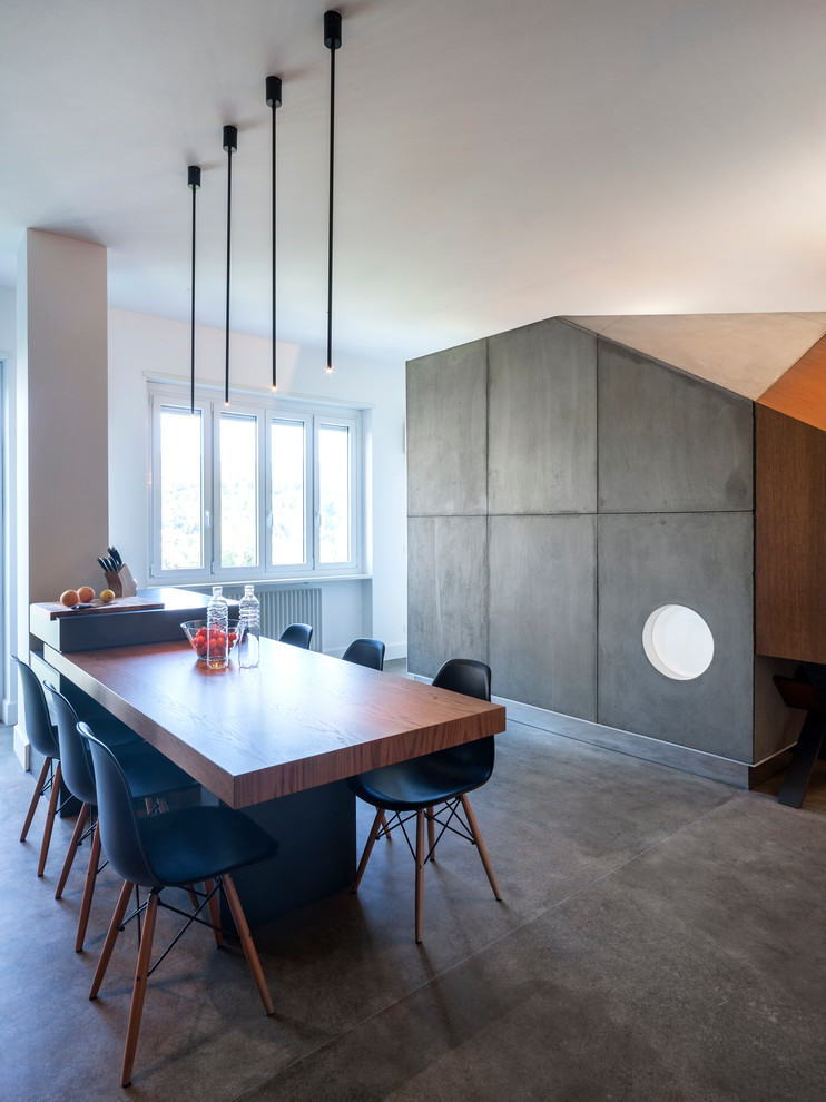 Пример оригинального дизайна: кухня-столовая среднего размера в современном стиле с серыми стенами и серым полом
