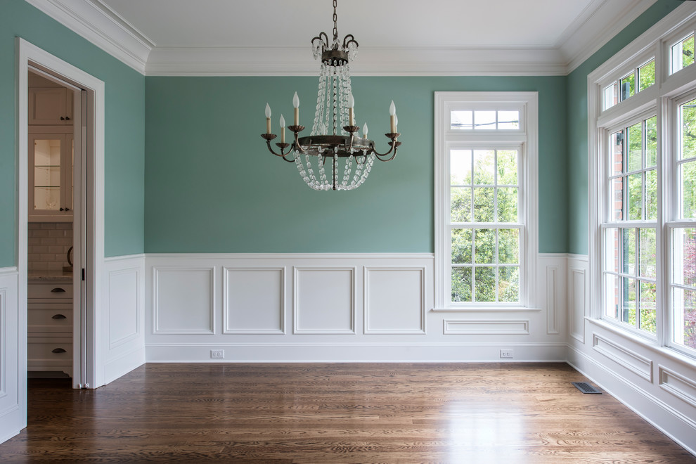 Inspiration for a medium sized traditional dining room in Other with green walls, medium hardwood flooring and no fireplace.