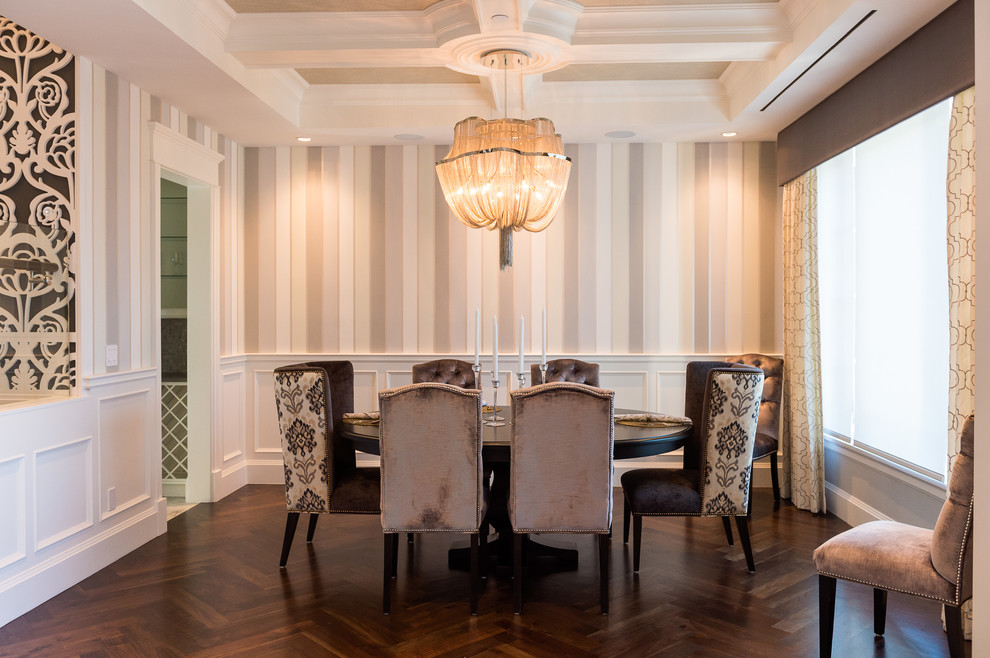 This is an example of a classic enclosed dining room in Vancouver with dark hardwood flooring.