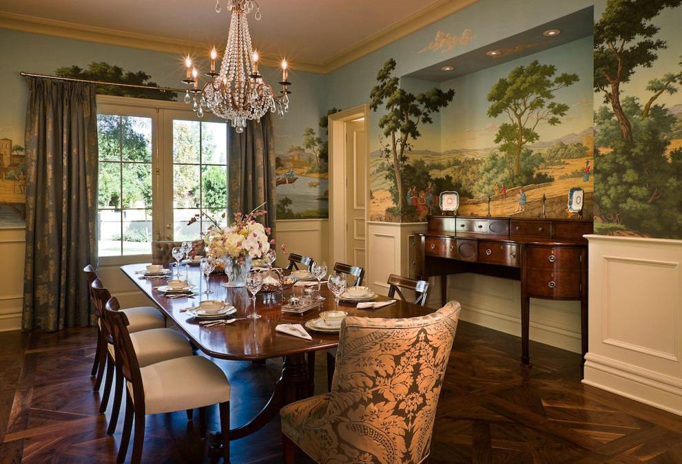 Elegant dark wood floor enclosed dining room photo in Los Angeles with multicolored walls