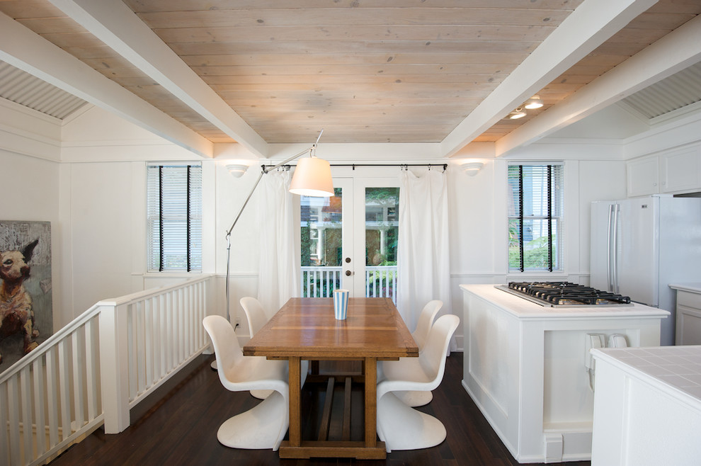 Example of an eclectic dark wood floor kitchen/dining room combo design in San Francisco with white walls