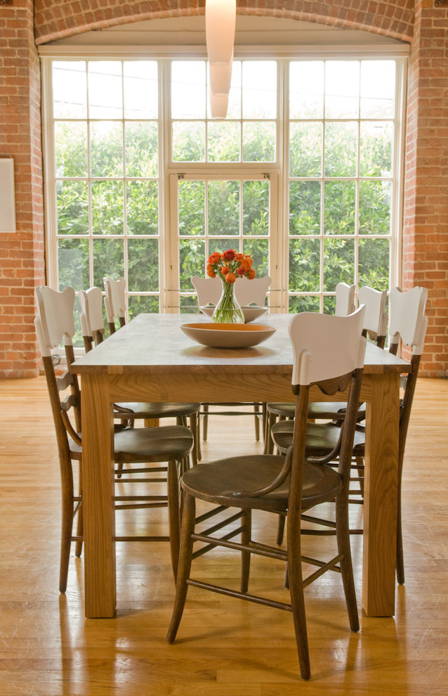 This is an example of a rustic dining room in San Francisco with medium hardwood flooring.