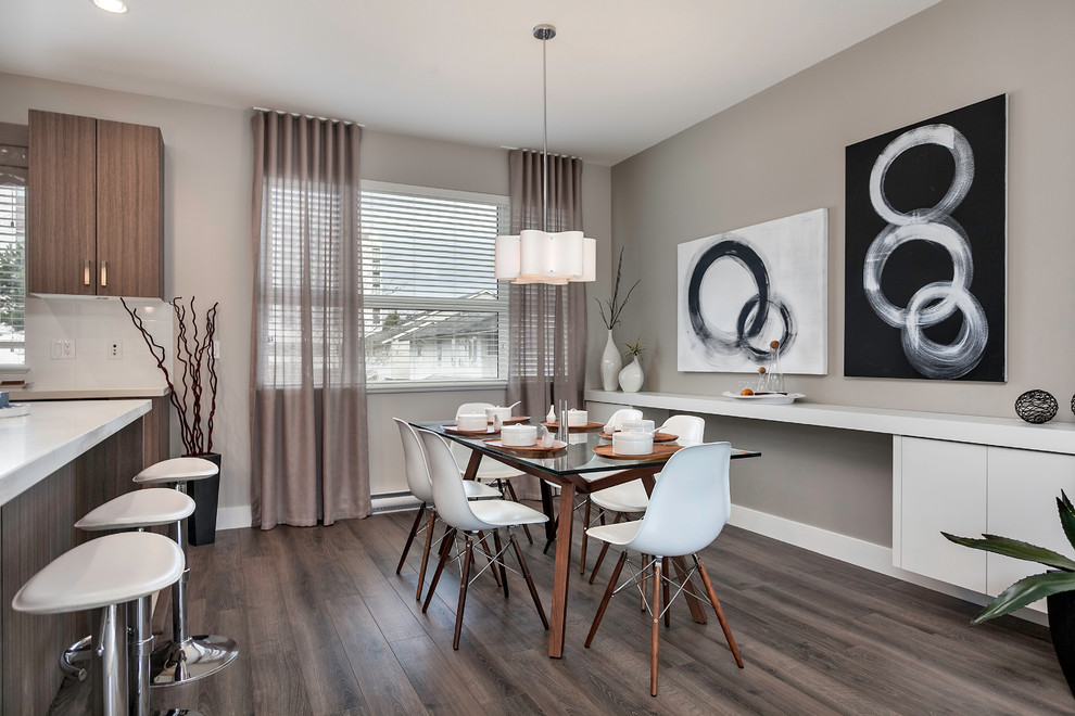 Small contemporary open plan dining room in Vancouver with grey walls, no fireplace and feature lighting.