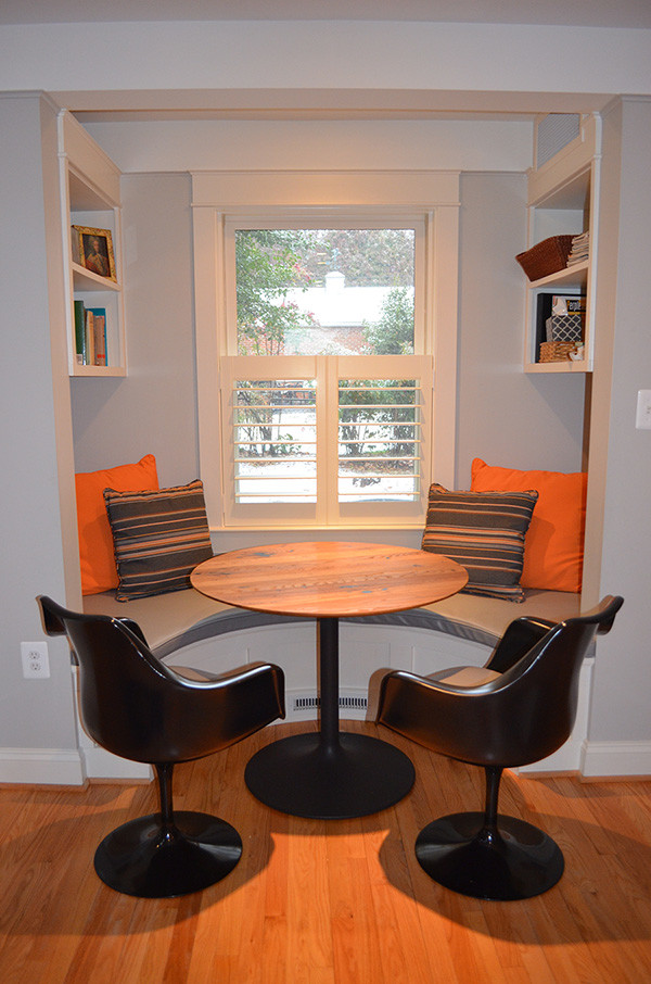 Small contemporary kitchen/dining room in DC Metro with blue walls, light hardwood flooring and no fireplace.