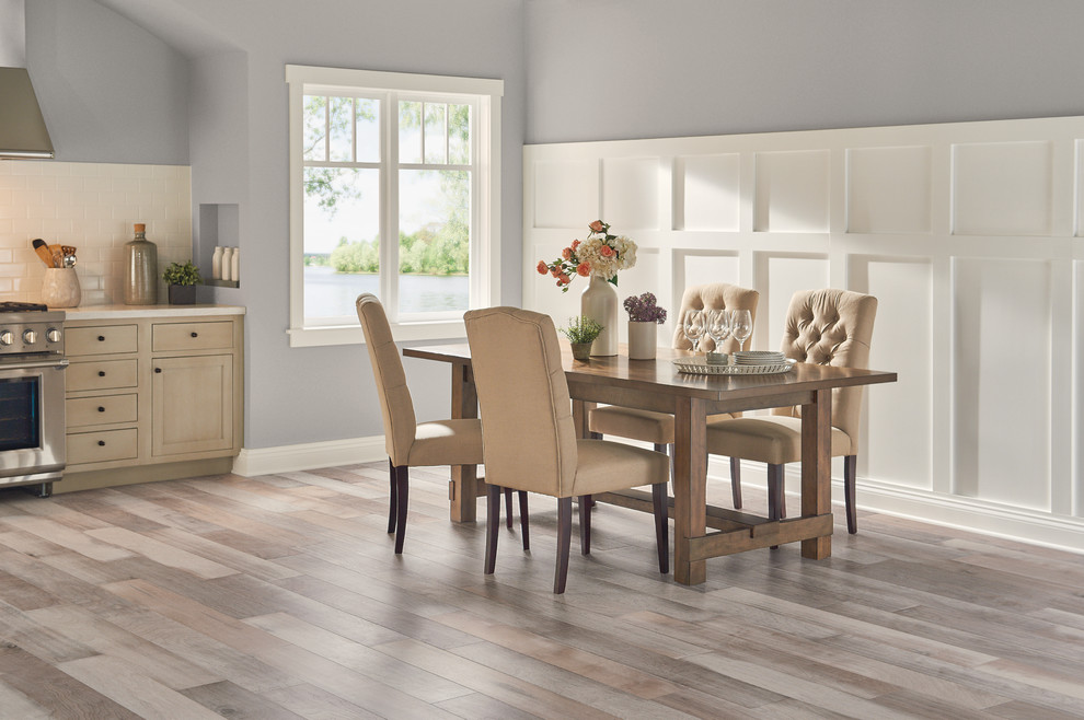 This is an example of a medium sized traditional kitchen/dining room in Los Angeles with grey walls, medium hardwood flooring, no fireplace and grey floors.