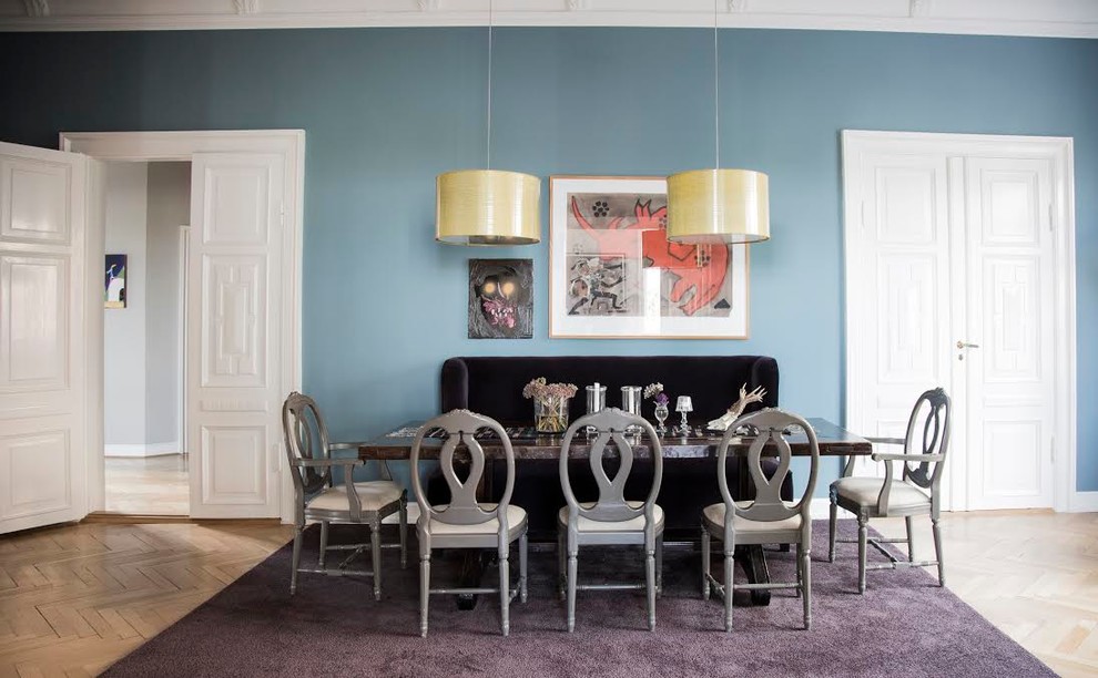 Contemporary dining room in Other with blue walls.