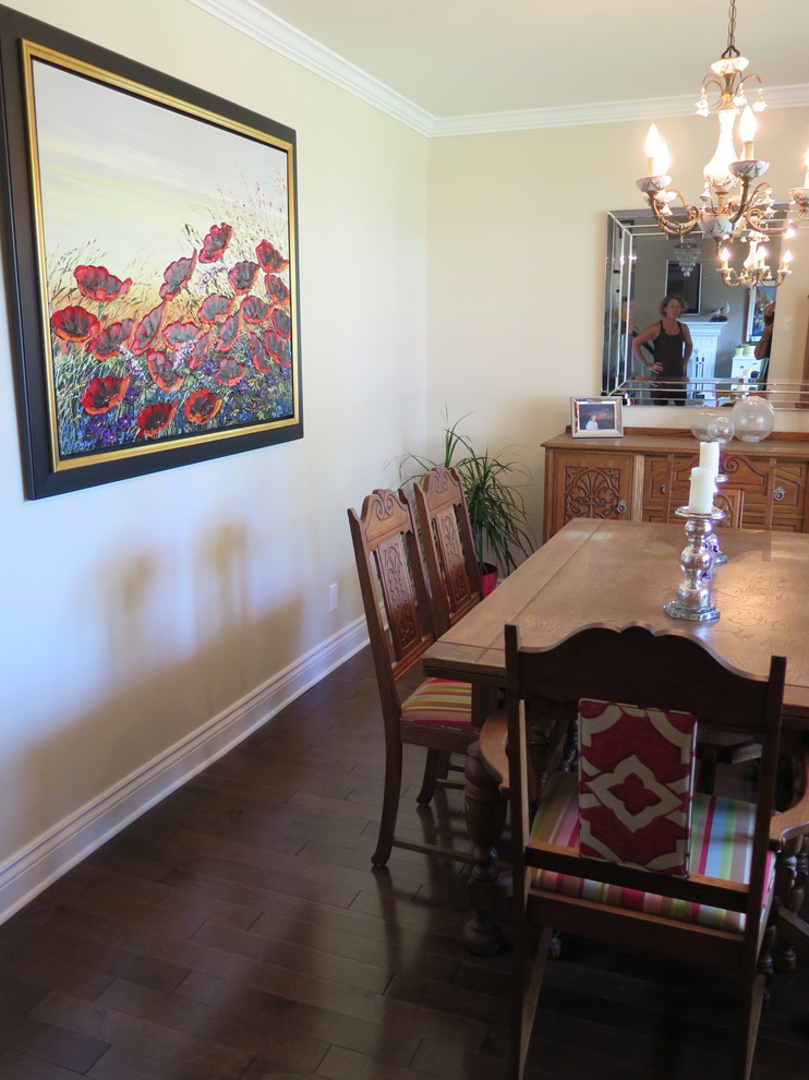 Photo of a medium sized traditional enclosed dining room in Montreal with beige walls and dark hardwood flooring.