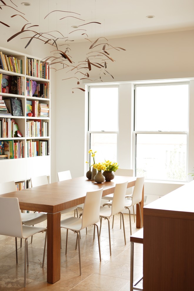 Example of a trendy beige floor dining room design in Chicago with white walls