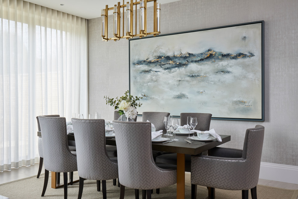 Example of a transitional beige floor dining room design in London with gray walls and no fireplace