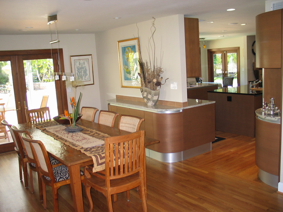 Kitchen/dining room combo - mid-sized modern medium tone wood floor kitchen/dining room combo idea in San Diego with white walls and no fireplace