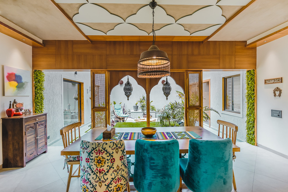 Design ideas for a world-inspired dining room in Ahmedabad.