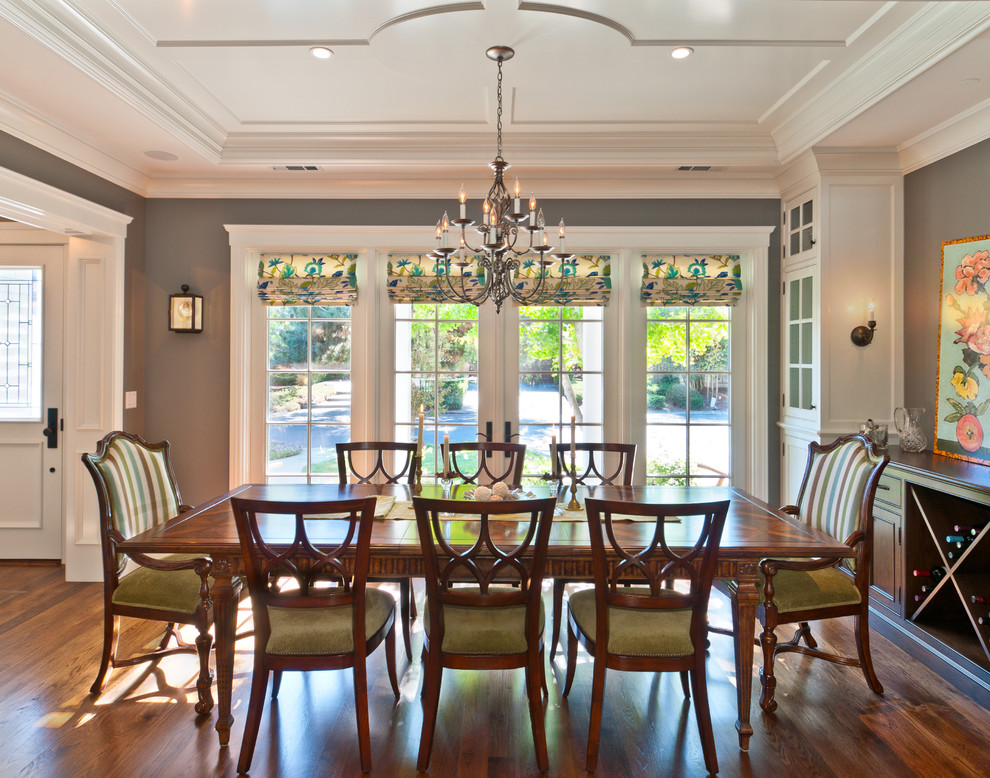 Example of a mid-sized classic dark wood floor enclosed dining room design in San Francisco with gray walls