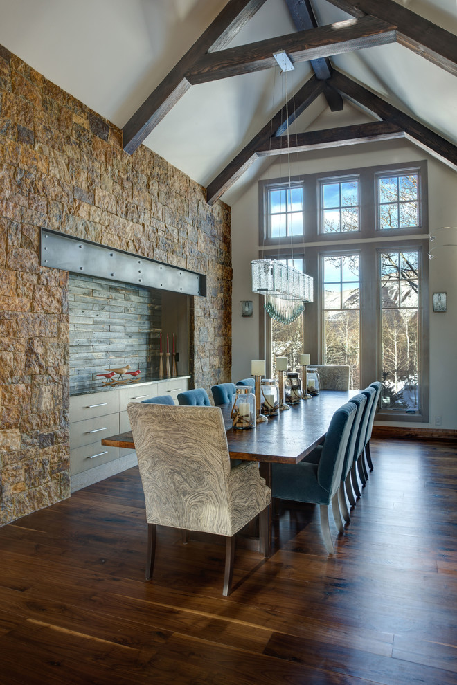 This is an example of a rustic enclosed dining room in Denver with white walls, dark hardwood flooring and no fireplace.