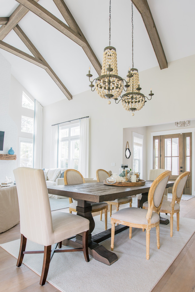 Photo of a large beach style open plan dining room in Jacksonville with grey walls, ceramic flooring and brown floors.