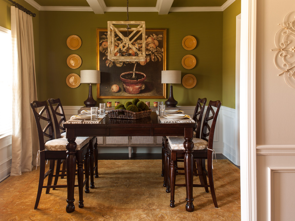 Photo of a small traditional enclosed dining room in Atlanta with green walls, dark hardwood flooring and brown floors.