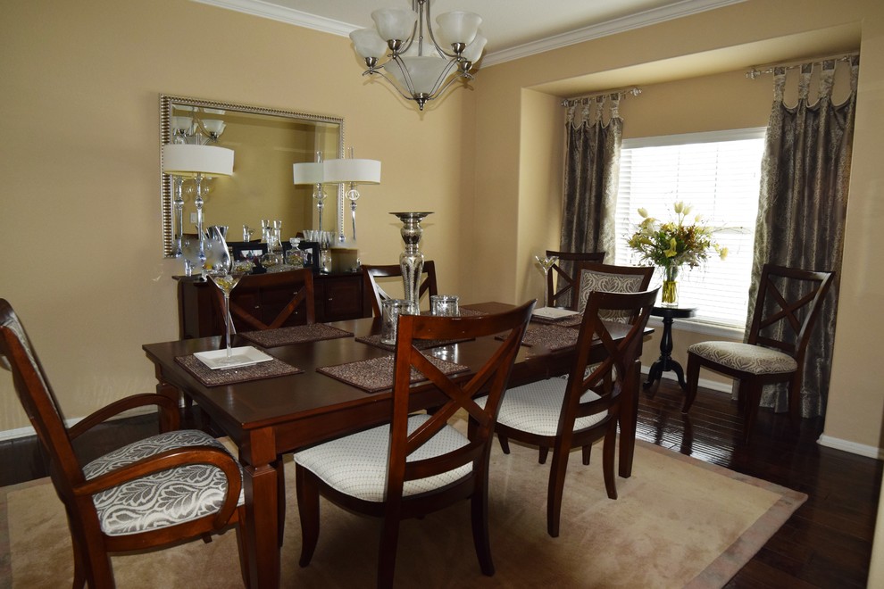 Example of a mid-sized transitional dark wood floor enclosed dining room design in Denver with beige walls