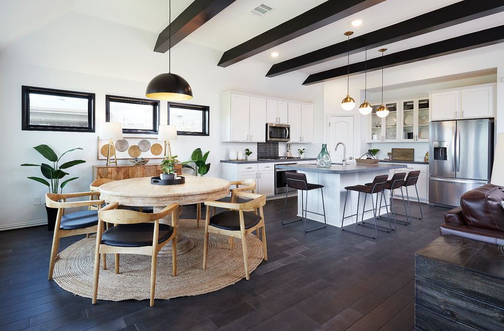 Medium sized contemporary kitchen/dining room in Austin with white walls, dark hardwood flooring and grey floors.