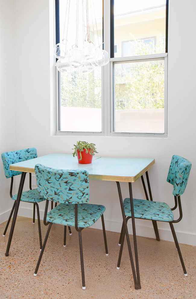 Dining room - contemporary dining room idea in Austin with white walls