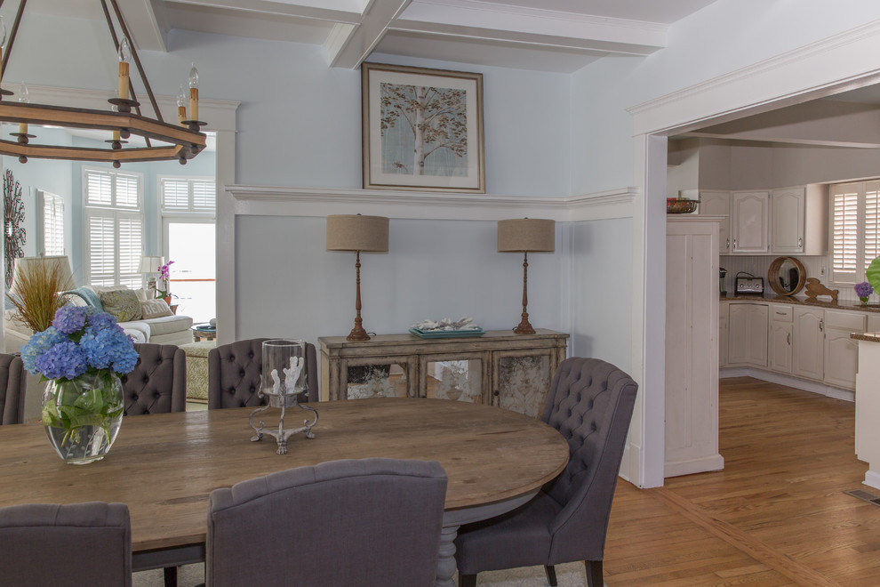 Mid-sized beach style light wood floor enclosed dining room photo in New York with blue walls and no fireplace