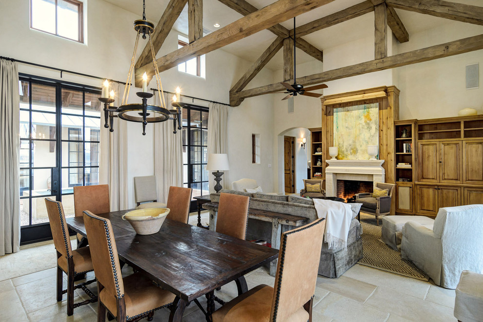 Rustic open plan dining room in Austin with white walls.