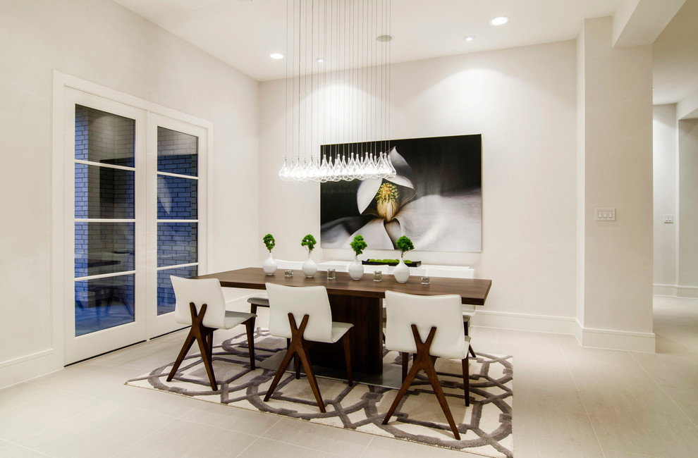 This is an example of a contemporary dining room in Dallas with white walls.