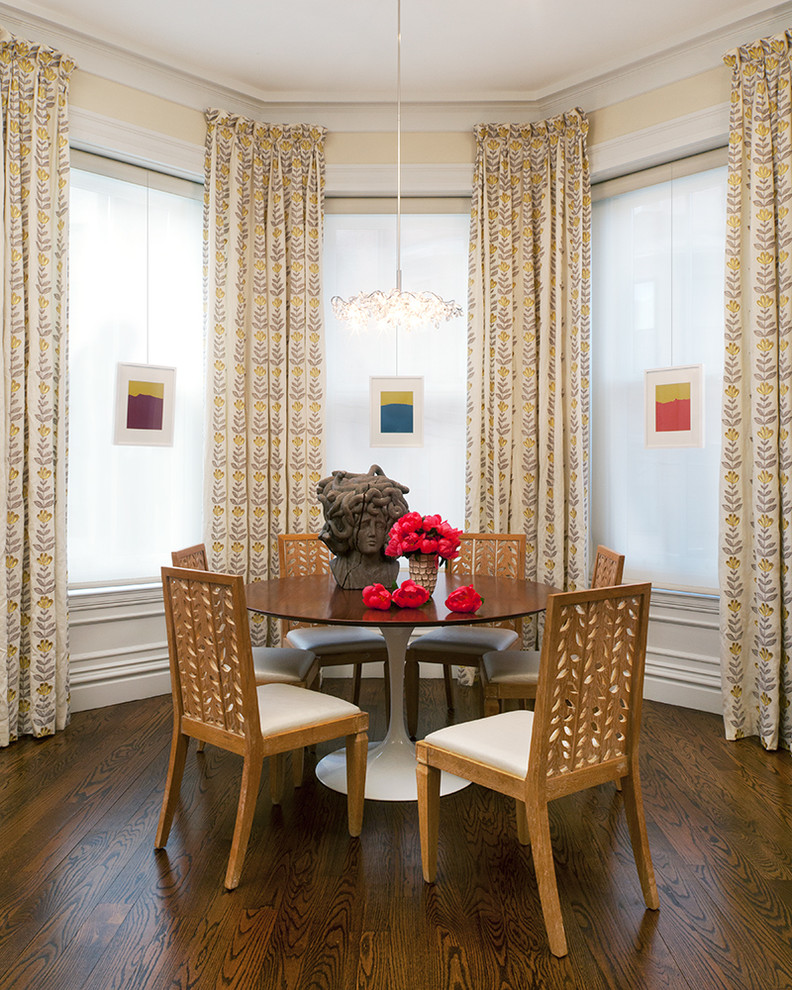 Example of a transitional dark wood floor dining room design in Boston with beige walls