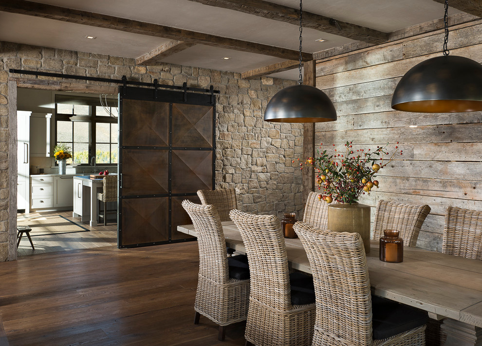 Photo of a rustic dining room in Other with dark hardwood flooring.