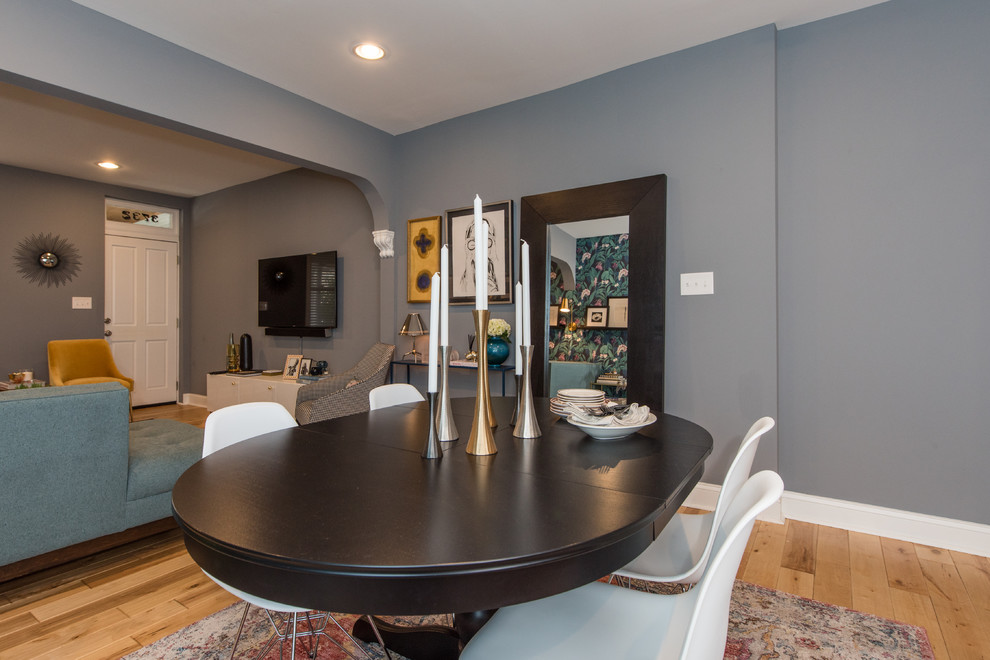 Photo of a medium sized retro open plan dining room in Baltimore with grey walls, light hardwood flooring, no fireplace and brown floors.