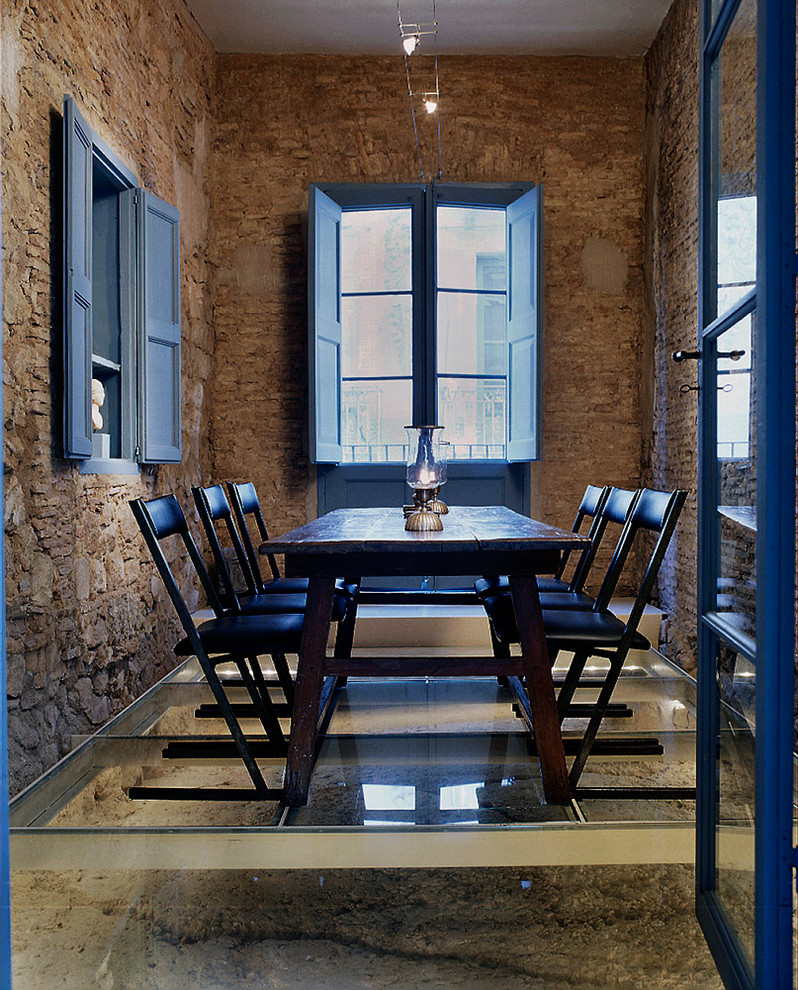 Photo of a farmhouse enclosed dining room in Barcelona.