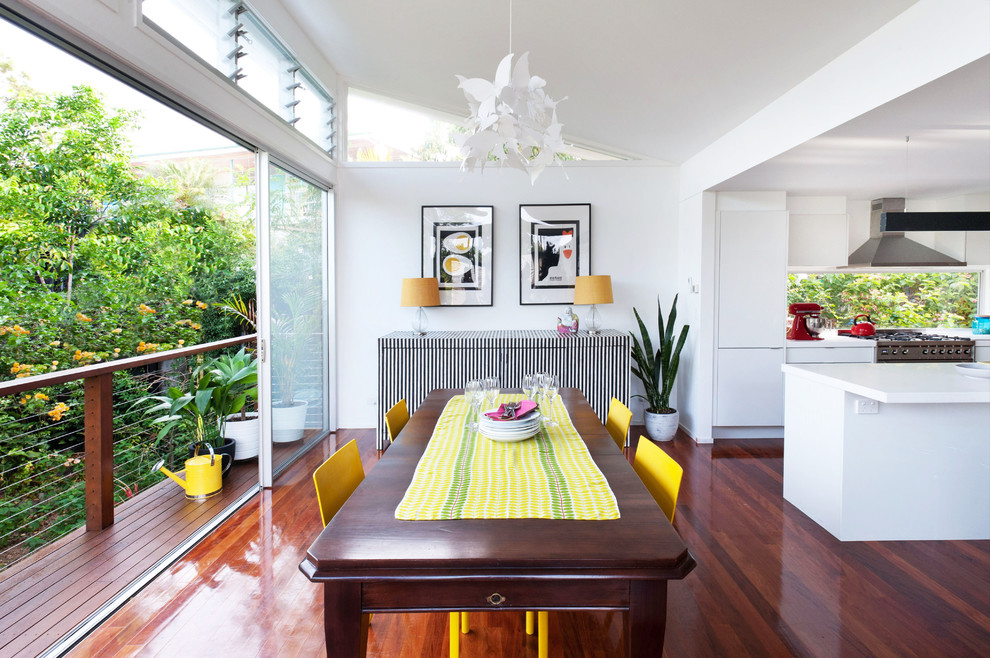 Inspiration for a mid-sized contemporary dark wood floor and brown floor kitchen/dining room combo remodel in Brisbane with white walls