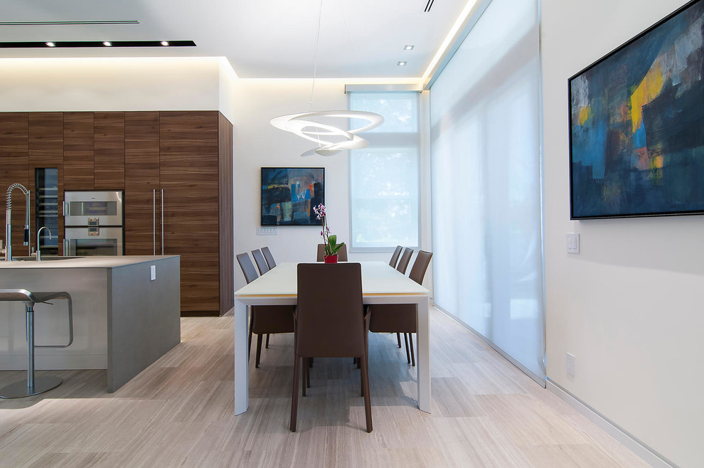 Medium sized contemporary kitchen/dining room in Miami with white walls and marble flooring.