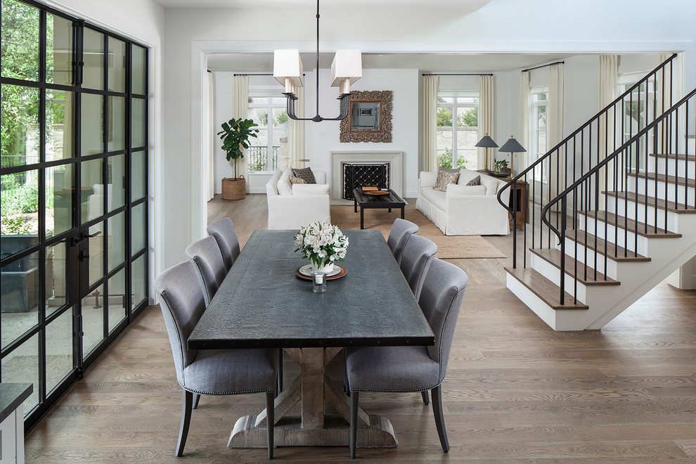 Inspiration for a transitional medium tone wood floor great room remodel in Austin with white walls