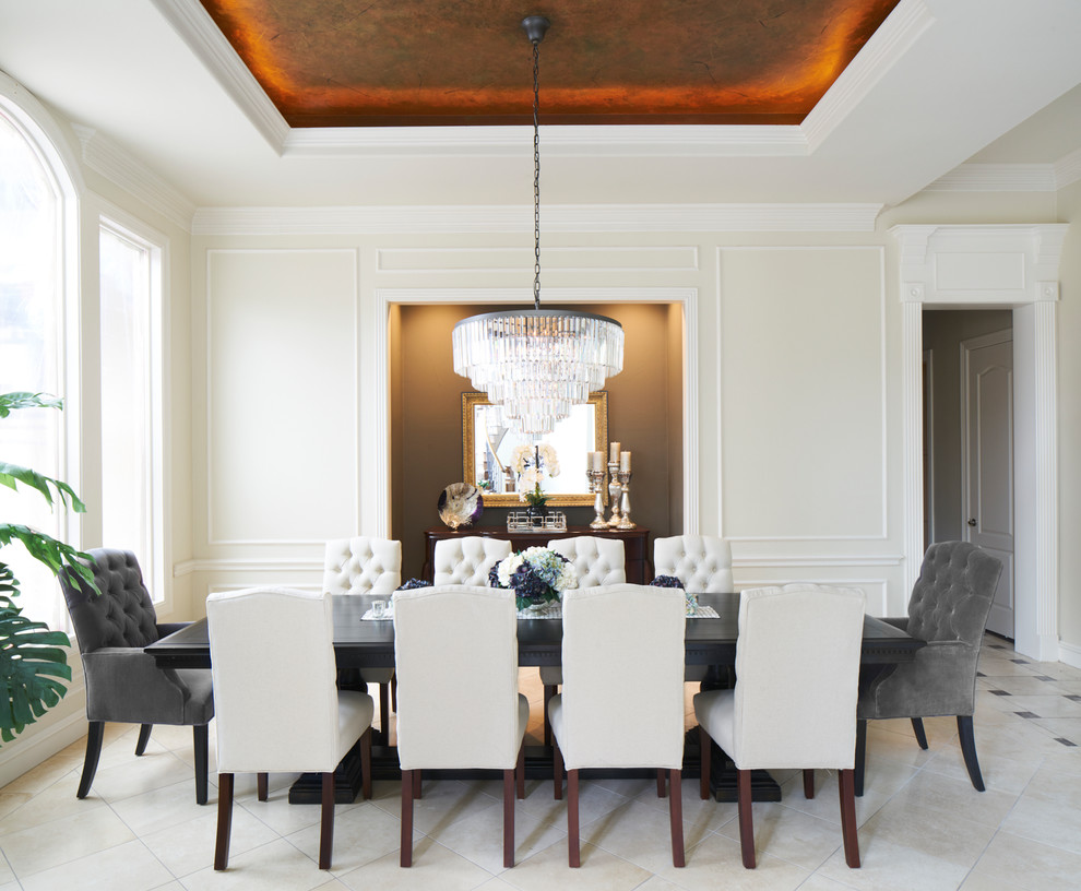 Mediterranean dining room in Austin with beige walls and beige floors.