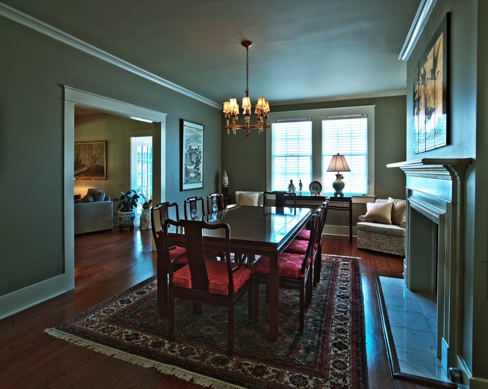 Large elegant dark wood floor kitchen/dining room combo photo in Atlanta with gray walls, a standard fireplace and a wood fireplace surround