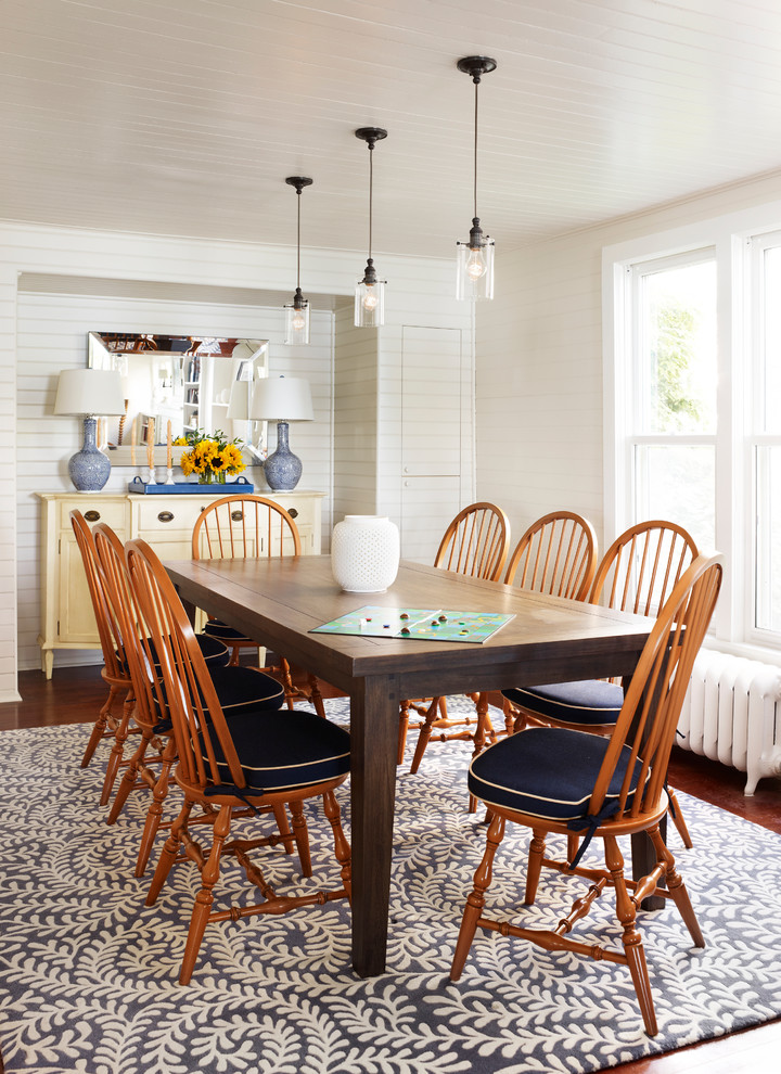 Example of a classic dark wood floor dining room design in Chicago with white walls