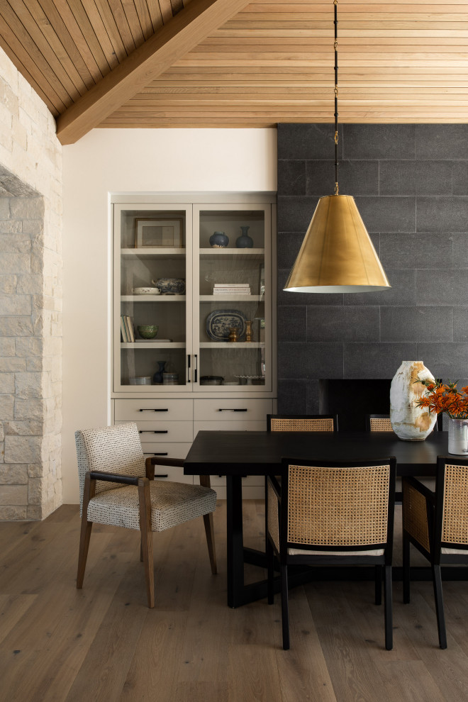 Photo of a farmhouse dining room in Los Angeles with white walls, medium hardwood flooring, brown floors, a vaulted ceiling and a wood ceiling.