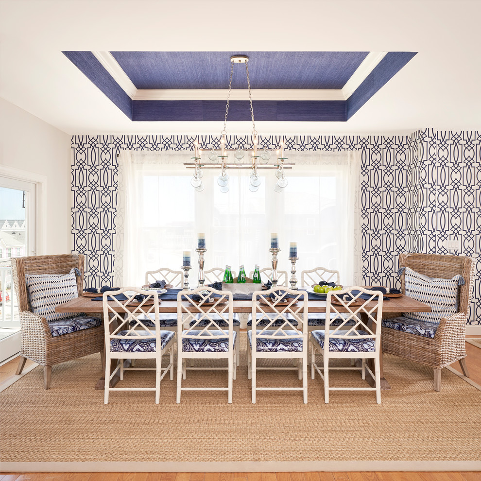 Large beach style medium tone wood floor and brown floor kitchen/dining room combo photo in Philadelphia with blue walls