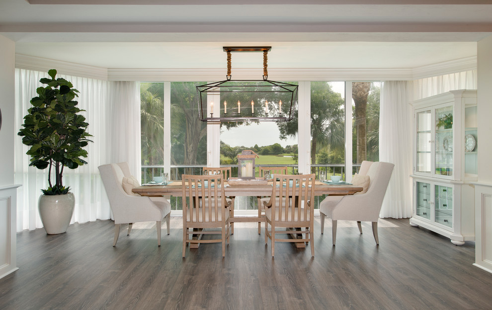 Inspiration for a mid-sized coastal dark wood floor and brown floor kitchen/dining room combo remodel in Miami with gray walls and no fireplace