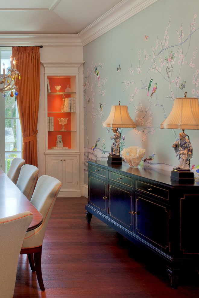 Photo of a world-inspired dining room in Miami with feature lighting.